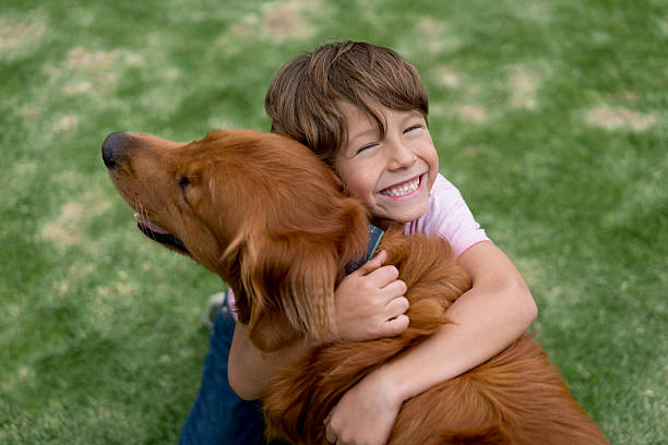 child volunteer pictured with dog